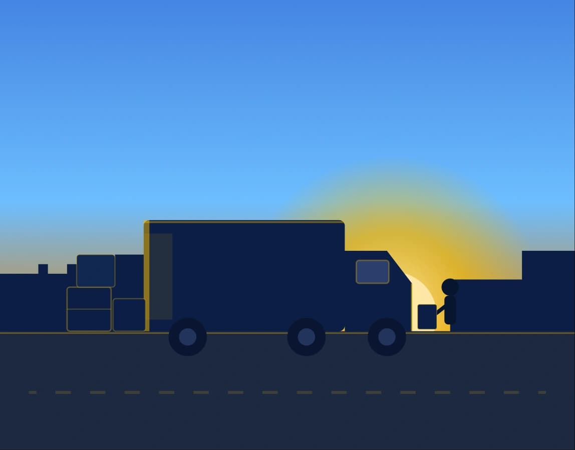 Delivery truck being loaded at sunrise for food and beverage distribution
